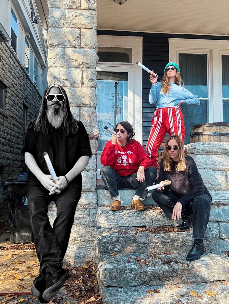 The band duchess posing on a porch holding comically large cigarettes. Everyong is wearing sunglasses. Todd the Bassist is clearly photoshopped into the picture.